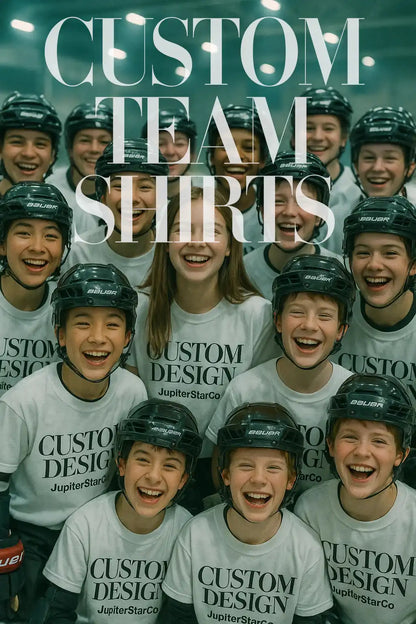 A group of young hockey players wearing matching white custom t-shirts with the text "CUSTOM DESIGN JupiterStarCo" and black helmets, smiling together on an indoor ice rink. Promotional image for custom team shirts.